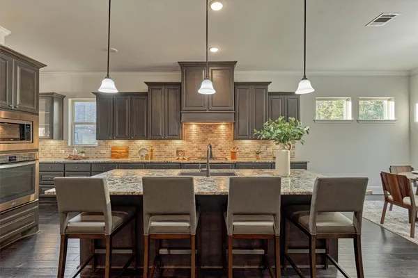 a living room with fireplace furniture and a wooden floor