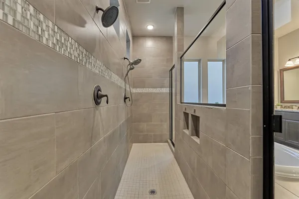 a kitchen with white cabinets and sink