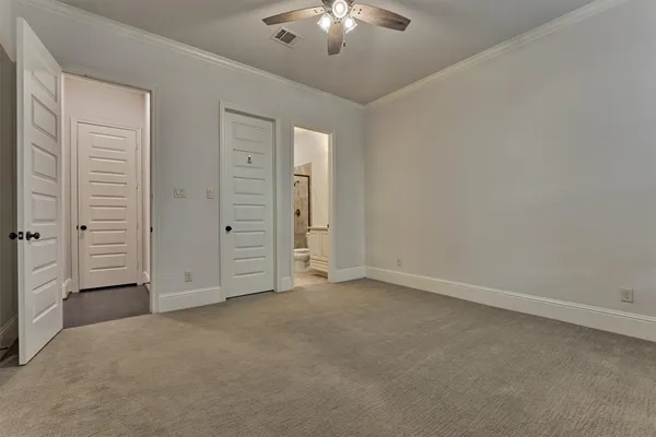 a bathroom with a shower sink vanity mirror and toilet