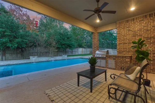 a view of backyard with a garden and outdoor seating