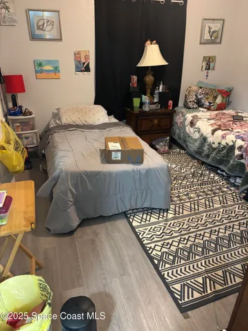 a bedroom with bed and a table