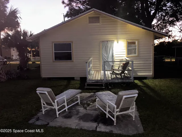 a front view of a house with patio