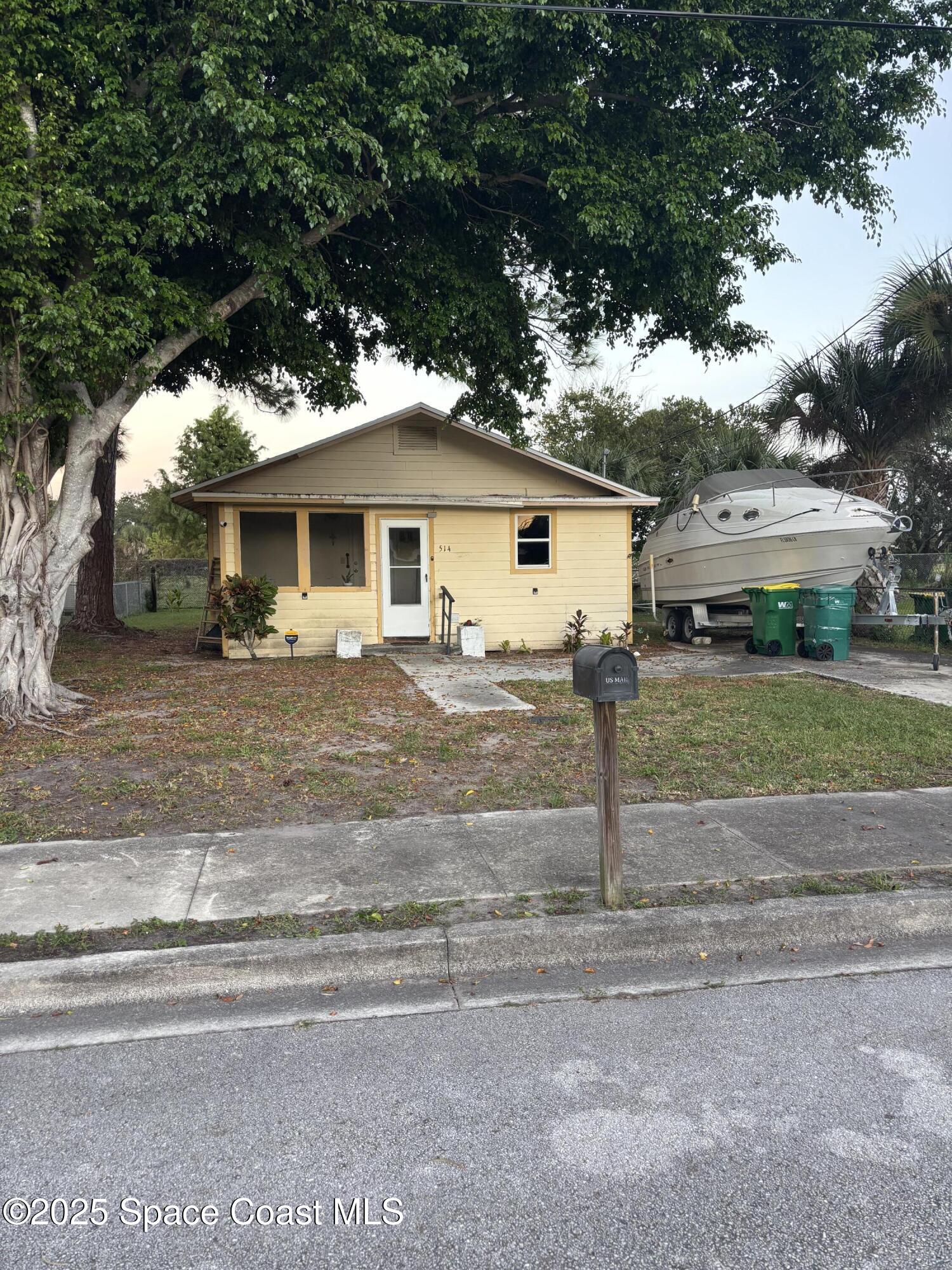 514 Donley Street Cocoa, FL 32922 - Photo 20 of 22 a view of a house with a yard