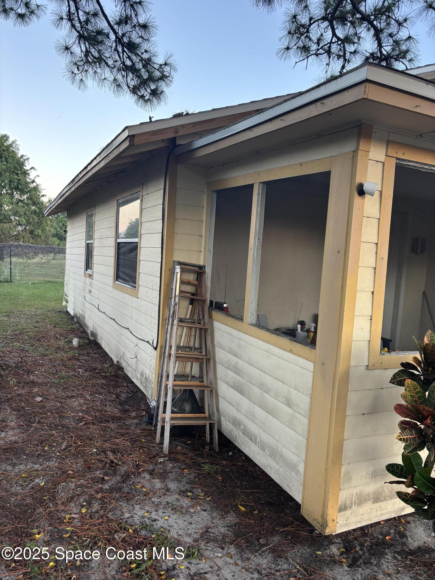 514 Donley Street Cocoa, FL 32922 - Photo 21 of 22 a view of a house with a yard