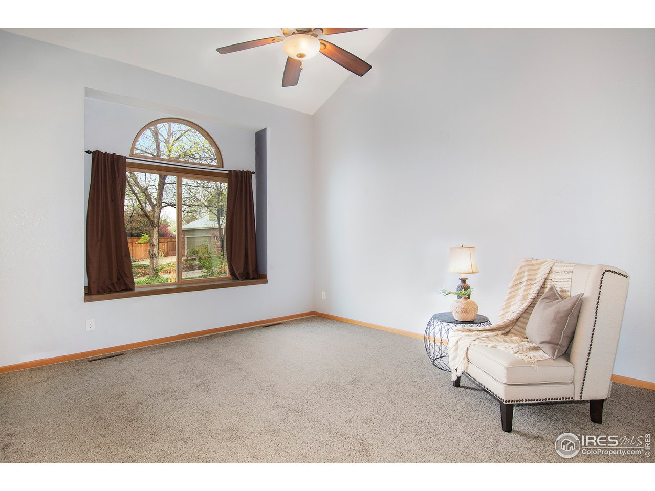 1706 Rutledge Court Fort Collins, CO 80526 - Photo 3 of 20 Vaulted living room. New carpet throughout, 2019.
