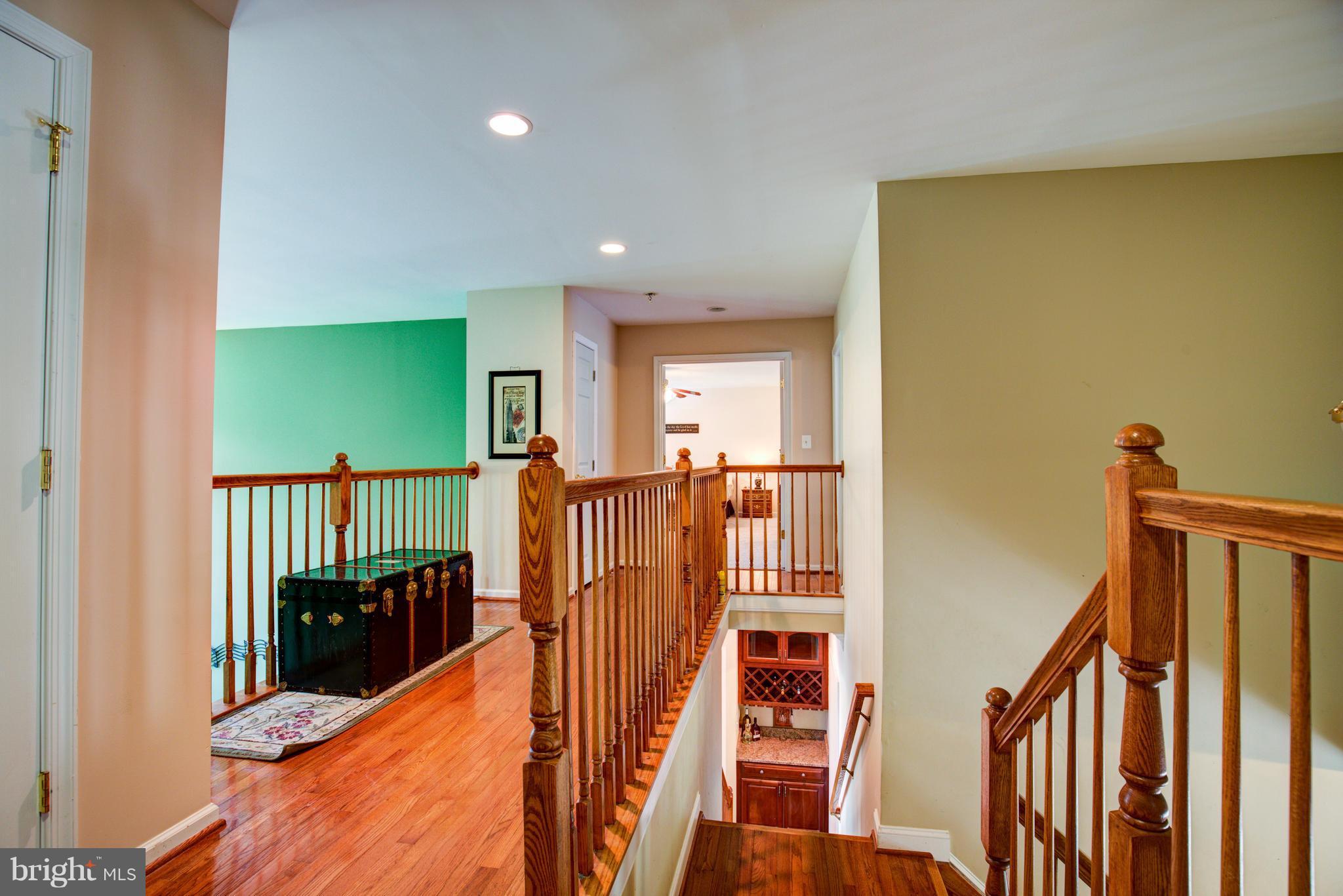 410 Old Kitchen Road White Post, VA 22663 - Photo 17 of 27 a view of a hallway with wooden floor and staircase