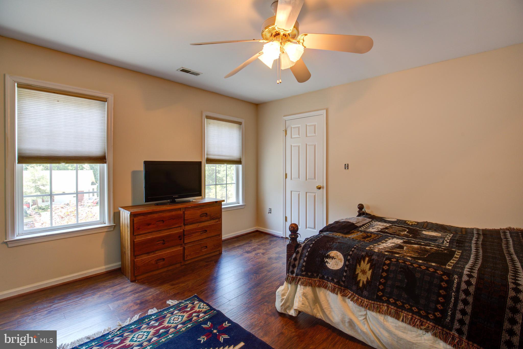 410 Old Kitchen Road White Post, VA 22663 - Photo 24 of 27 a bedroom with a bed and a flat screen tv