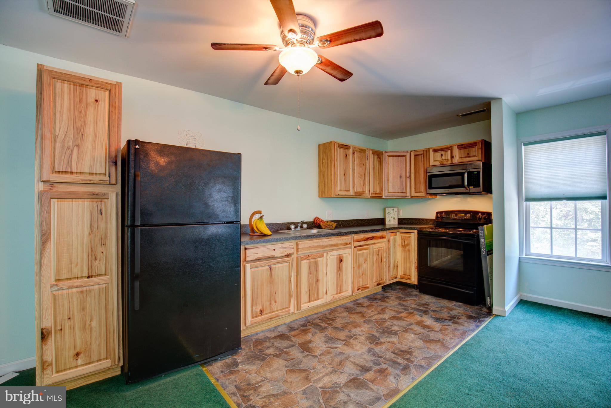 410 Old Kitchen Road White Post, VA 22663 - Photo 27 of 27 a kitchen with granite countertop stainless steel appliances a refrigerator cabinets and a stove