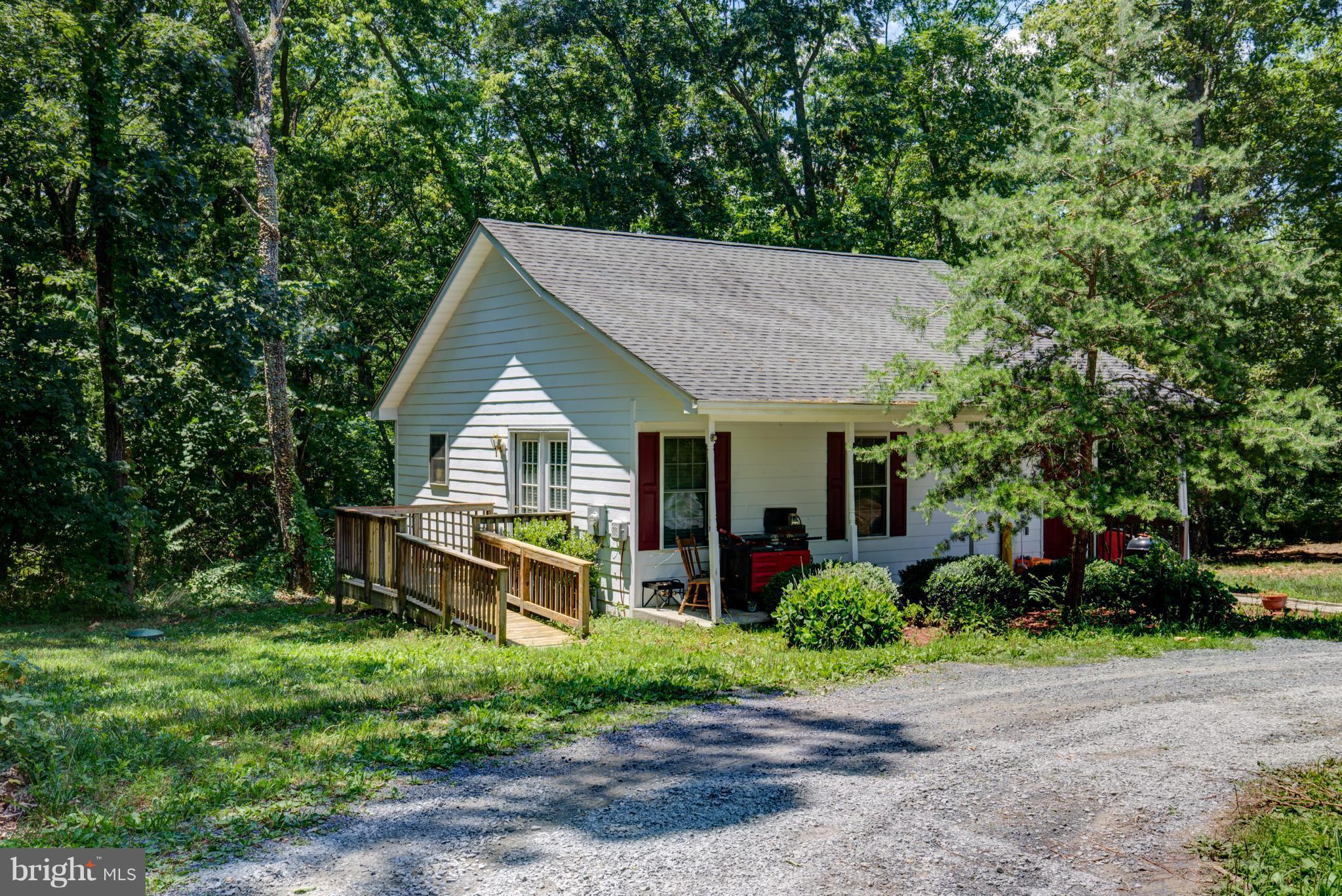 410 Old Kitchen Road White Post, VA 22663 - Photo 4 of 27 a front view of a house with garden