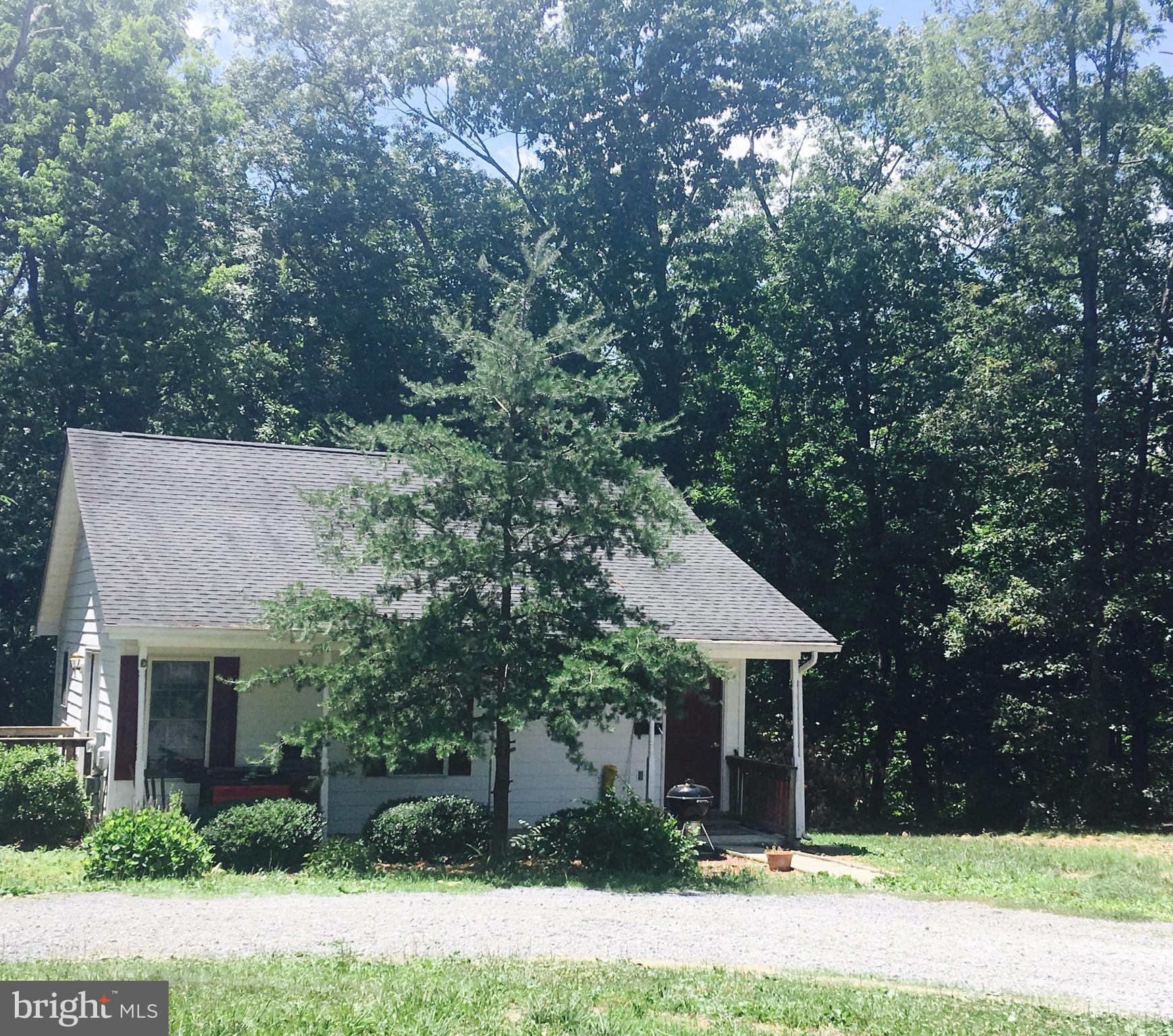 410 Old Kitchen Road White Post, VA 22663 - Photo 5 of 27 a front view of a house with a yard