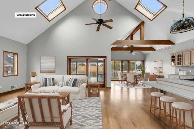 a view of workspace with wooden floor and furniture