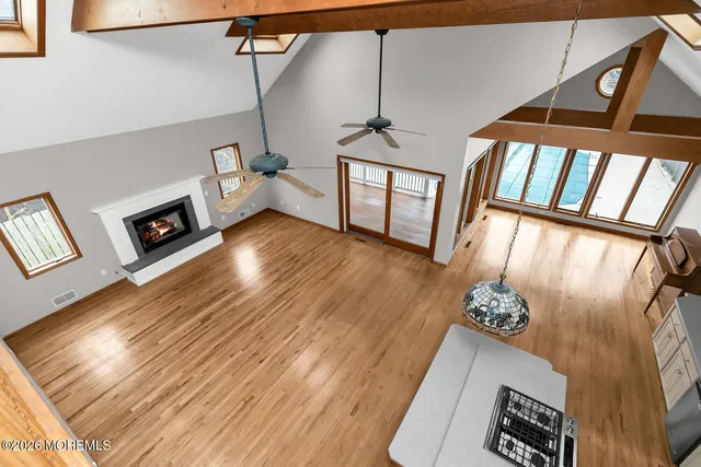 a view of an entryway with wooden floor