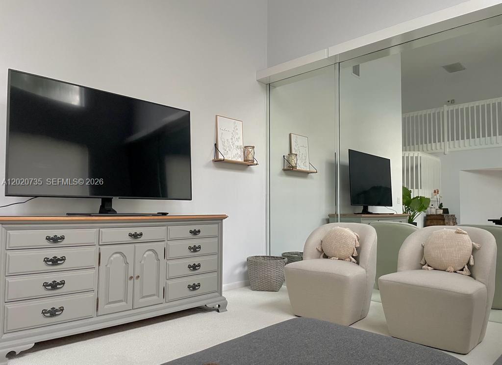 17244 Balboa Point Way Boca Raton, FL 33487 - Photo 39 of 66 a living room with furniture and a flat screen tv