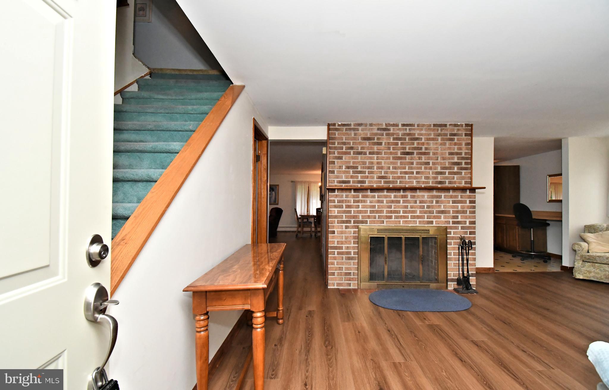 500 Burton Road Oreland, PA 19075 - Photo 4 of 54 Living room with wood burning fireplace