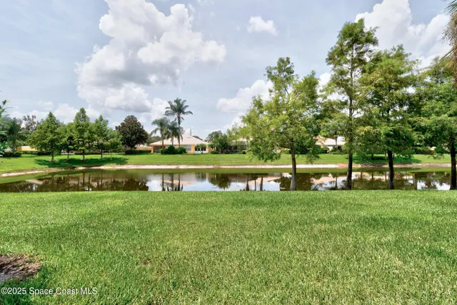 a view of a lake with houses in the back