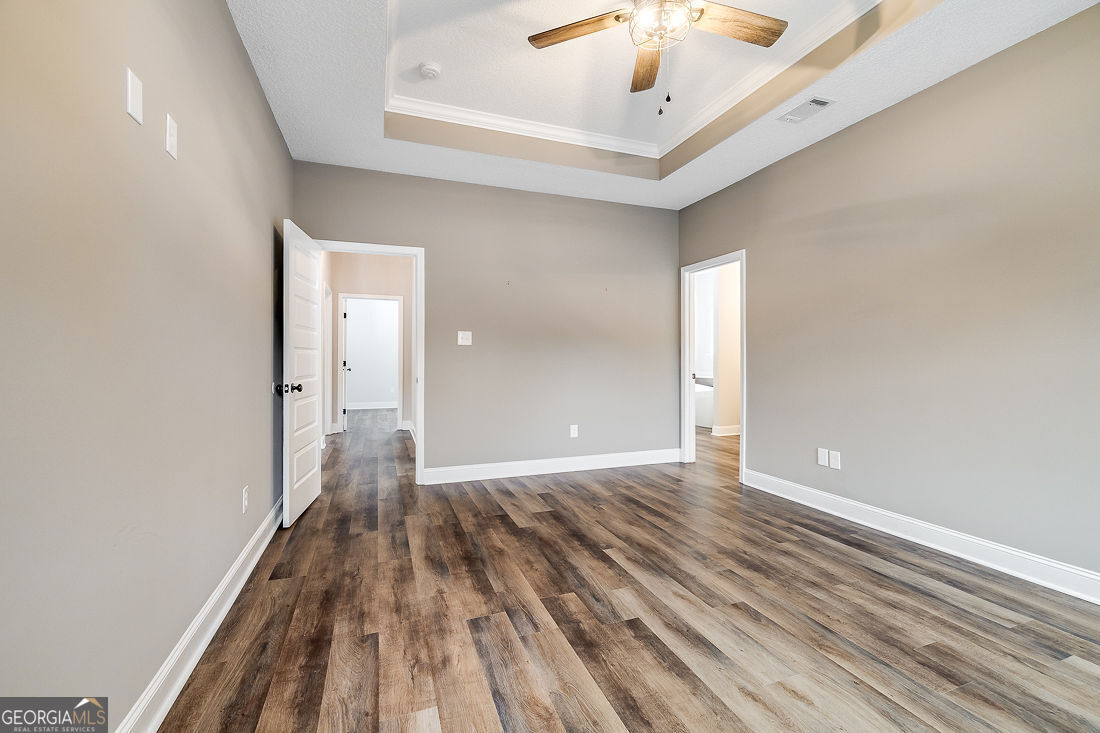 127 Winding Way Road Pembroke, GA 31321 - Photo 20 of 38 a view of a hallway with wooden floor
