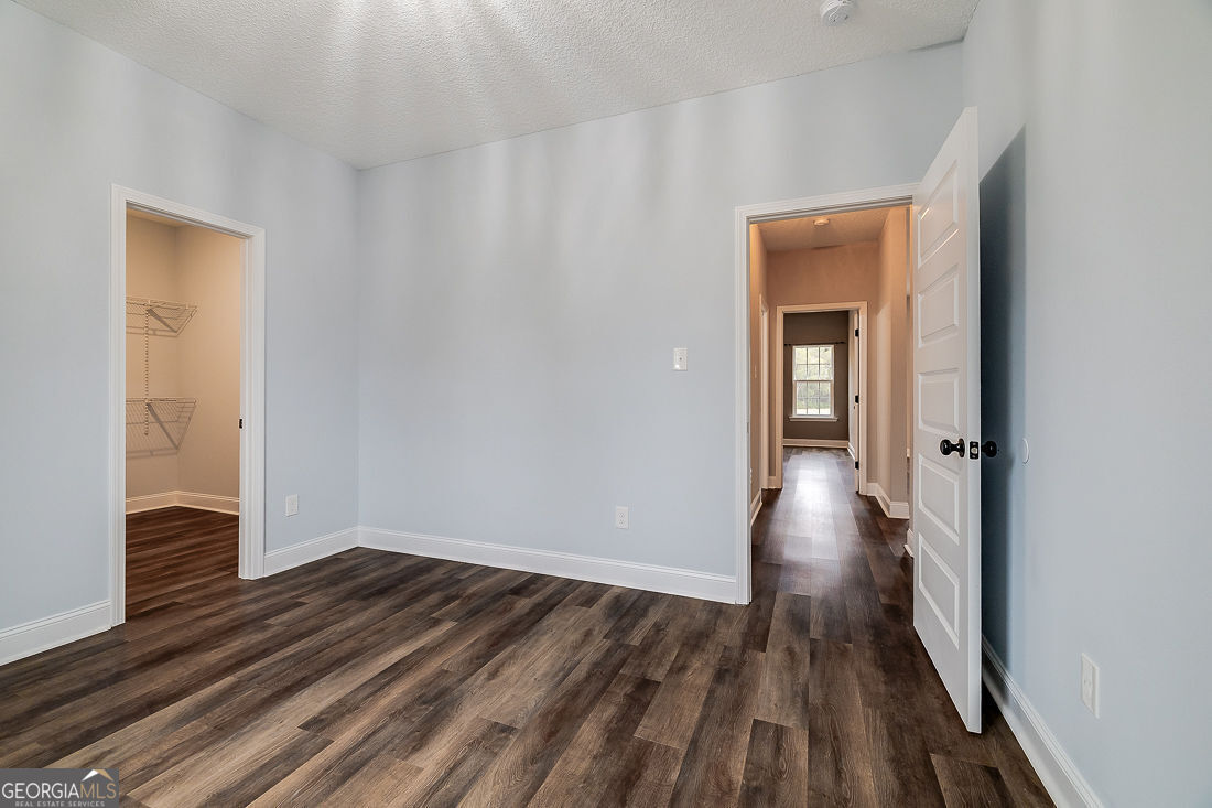 127 Winding Way Road Pembroke, GA 31321 - Photo 27 of 38 a view of a hallway with wooden floor and closet