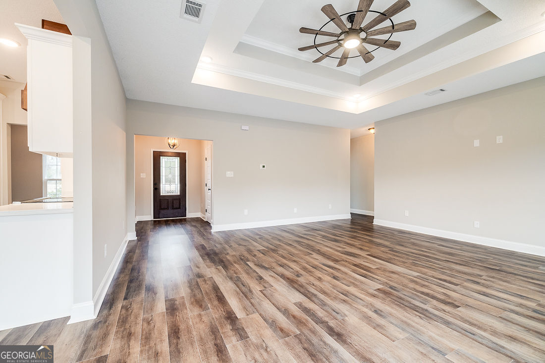 127 Winding Way Road Pembroke, GA 31321 - Photo 9 of 38 a view of empty room with wooden floor