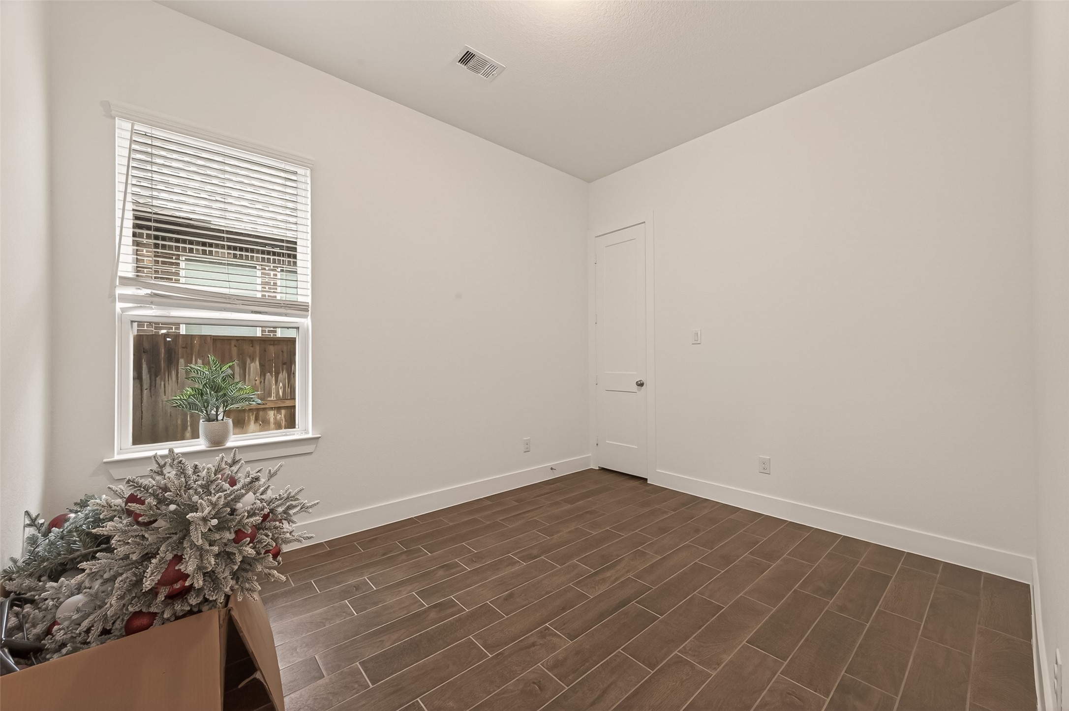 5019 Country Mdws Trail Rosharon, TX 77583 - Photo 28 of 49 wooden floor in an empty room