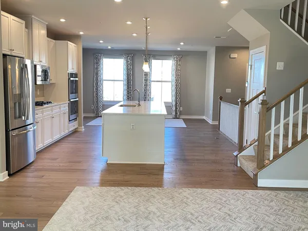 a view of kitchen with cabinets and stainless steel appliances