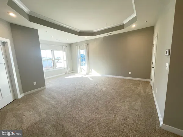 a bathroom with a granite countertop shower mirror and a sink