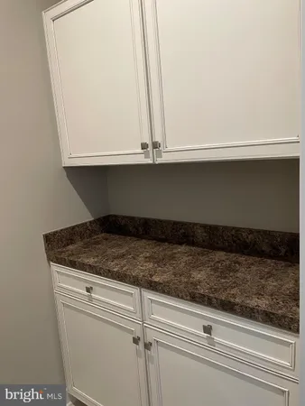 a view of a balcony with a barbeque