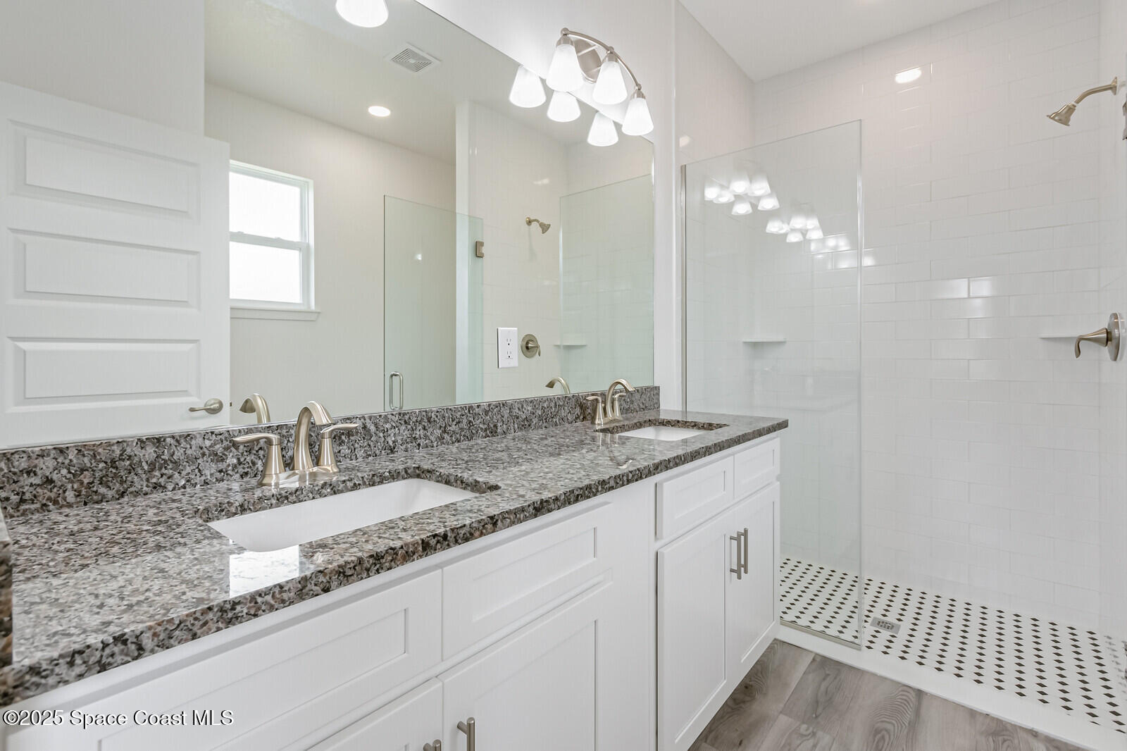 958 Chace Lane Northeast Palm Bay, FL 32905 - Photo 10 of 27 a bathroom with a sink and a mirror