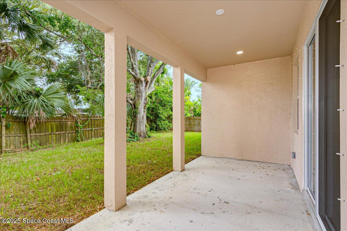 958 Chace Lane Northeast Palm Bay, FL 32905 - Photo 11 of 27 a view of a garden from a windows