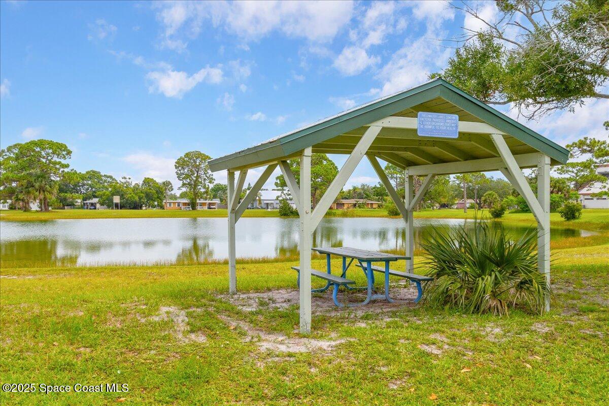 958 Chace Lane Northeast Palm Bay, FL 32905 - Photo 18 of 27 a swimming pool with outdoor seating and yard