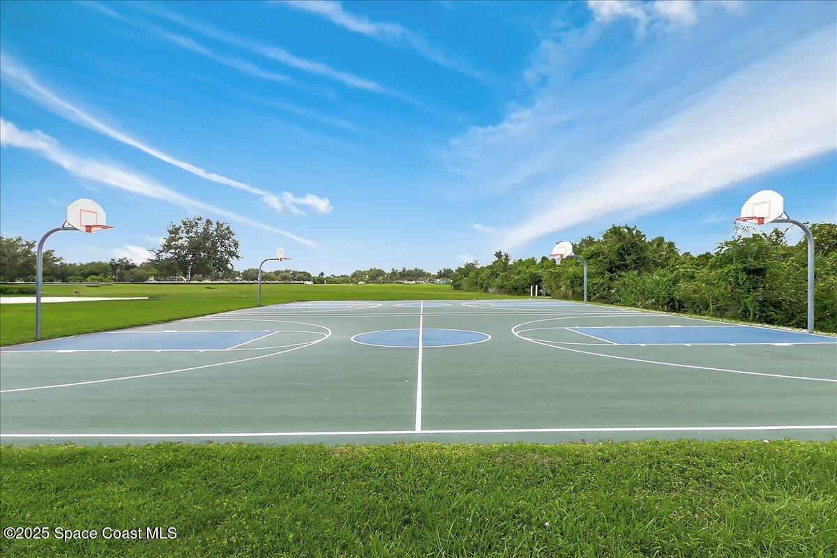 958 Chace Lane Northeast Palm Bay, FL 32905 - Photo 19 of 27 a view of a golf course with a lake