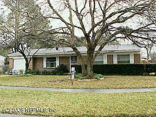 4885 Strato Road Jacksonville, FL 32210 - Photo 1 of 1 a front view of a house with a yard