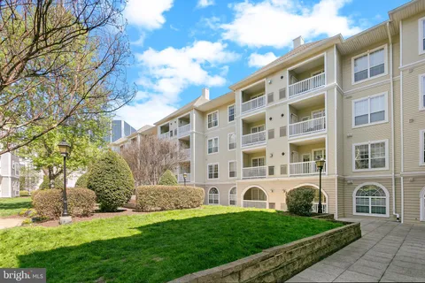 a view of a building with a yard