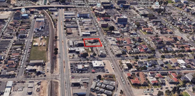 a front view of a building with street view