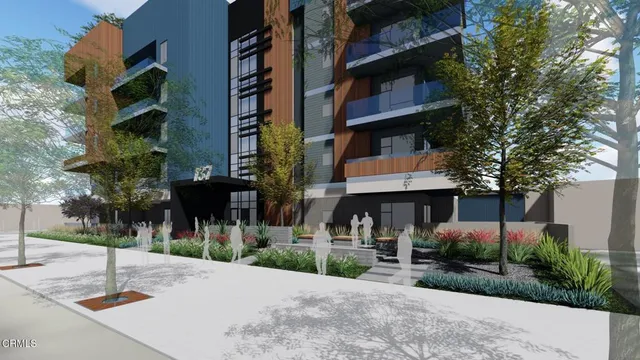 a street sign on a sidewalk next to a road