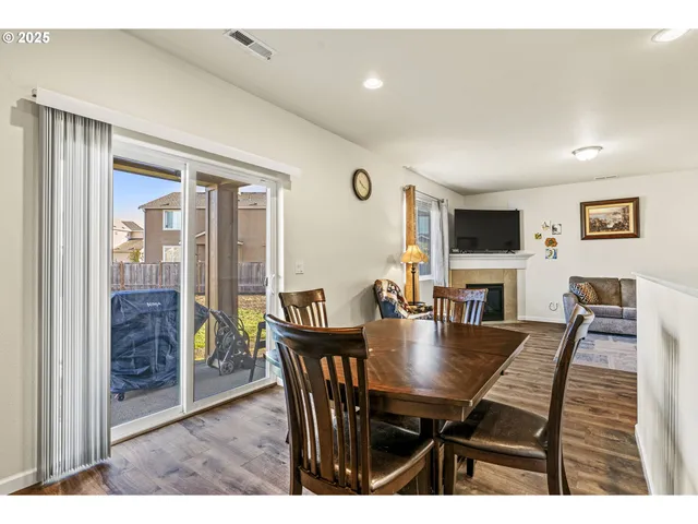 a view of a dining room with furniture and a livingroom