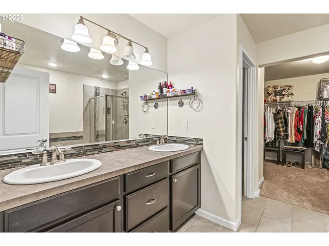 a bathroom with a sink vanity and a mirror