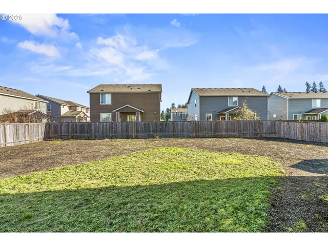 a swimming pool with outdoor seating and yard