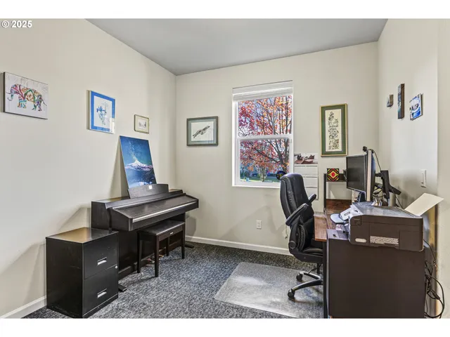 a view of a workspace with furniture