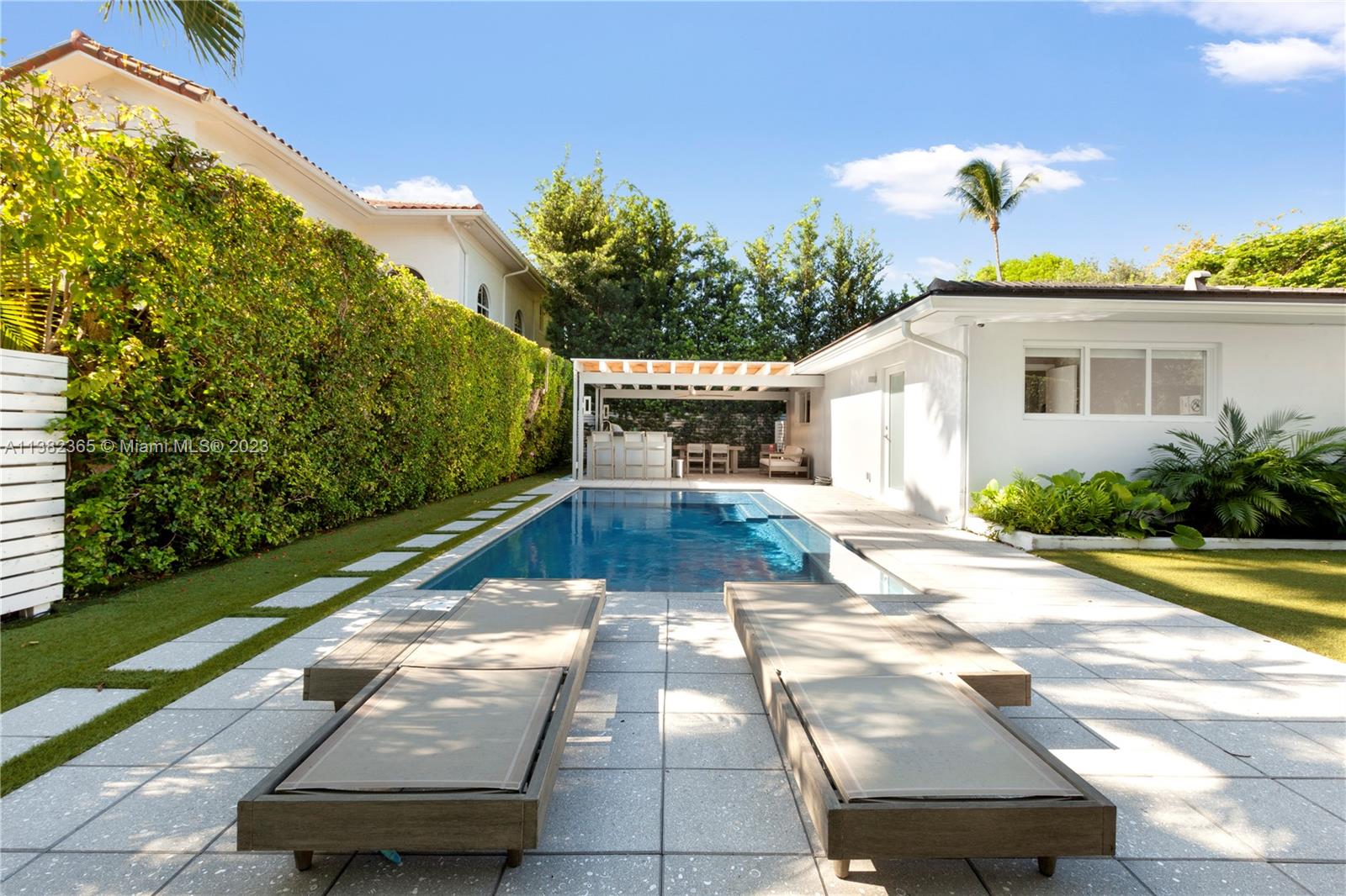 5356 Sunset Drive Miami, FL 33143 - Photo 1 of 29 a view of a white house with a yard