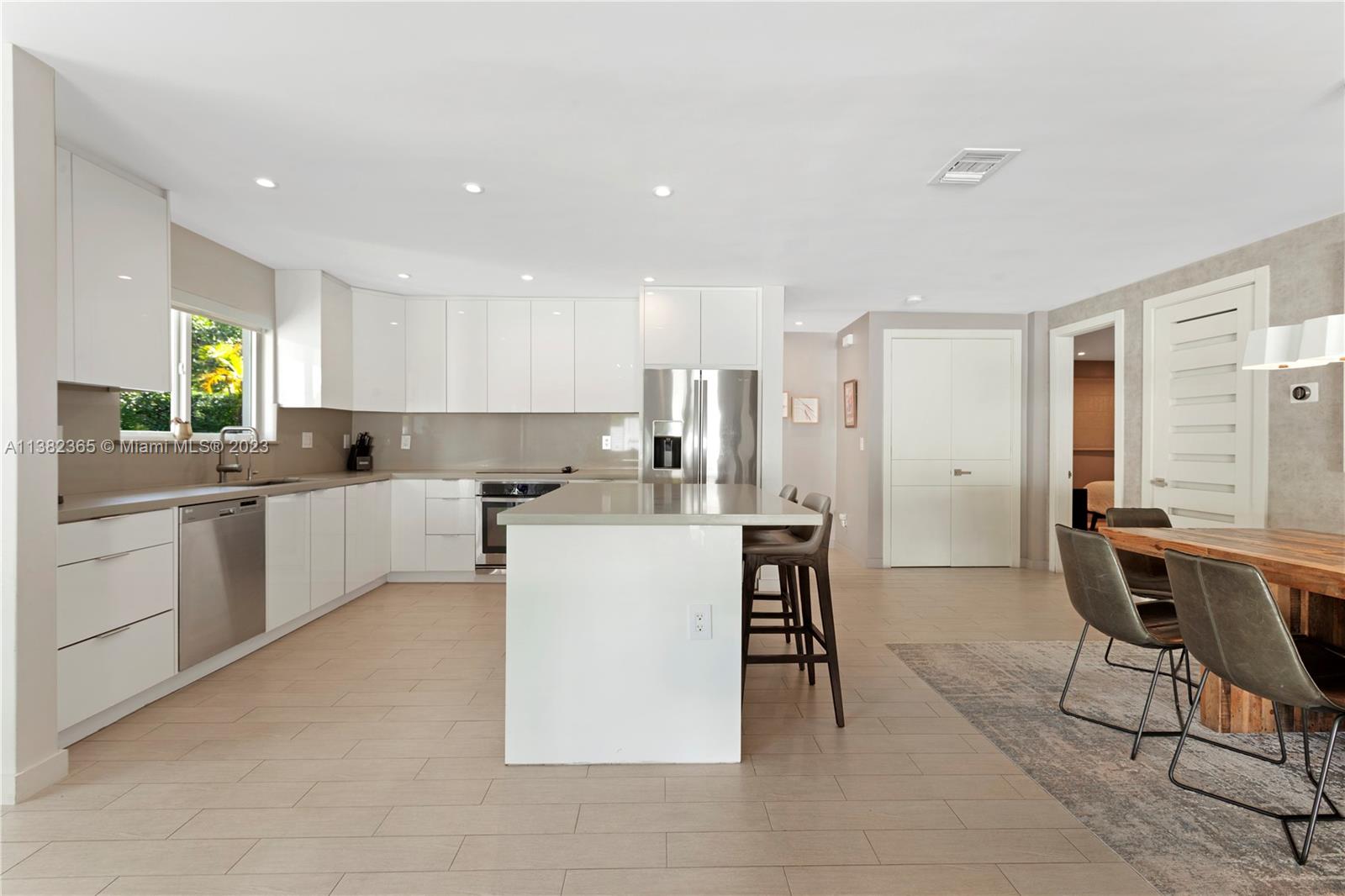 5356 Sunset Drive Miami, FL 33143 - Photo 15 of 29 a kitchen with a sink a counter top space and appliances
