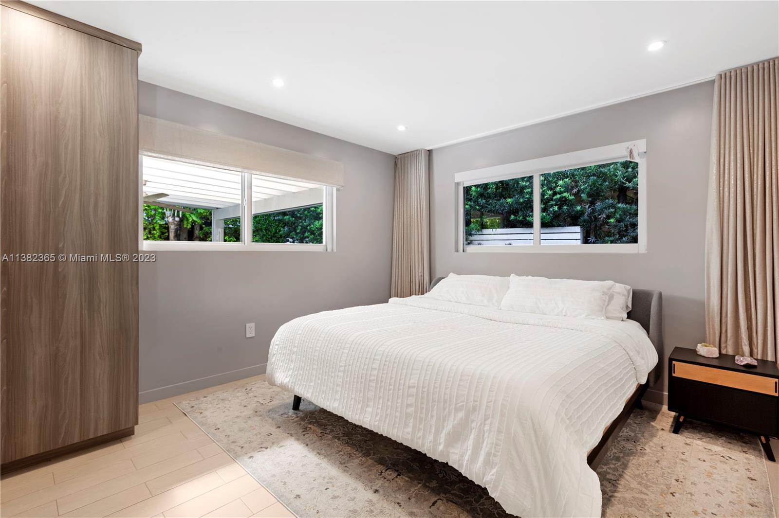 5356 Sunset Drive Miami, FL 33143 - Photo 17 of 29 a bedroom with a bed and window