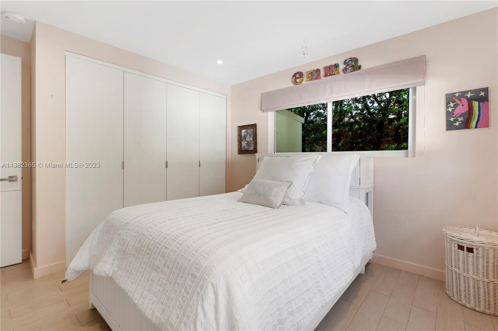 5356 Sunset Drive Miami, FL 33143 - Photo 19 of 29 a bedroom with a bed and a window