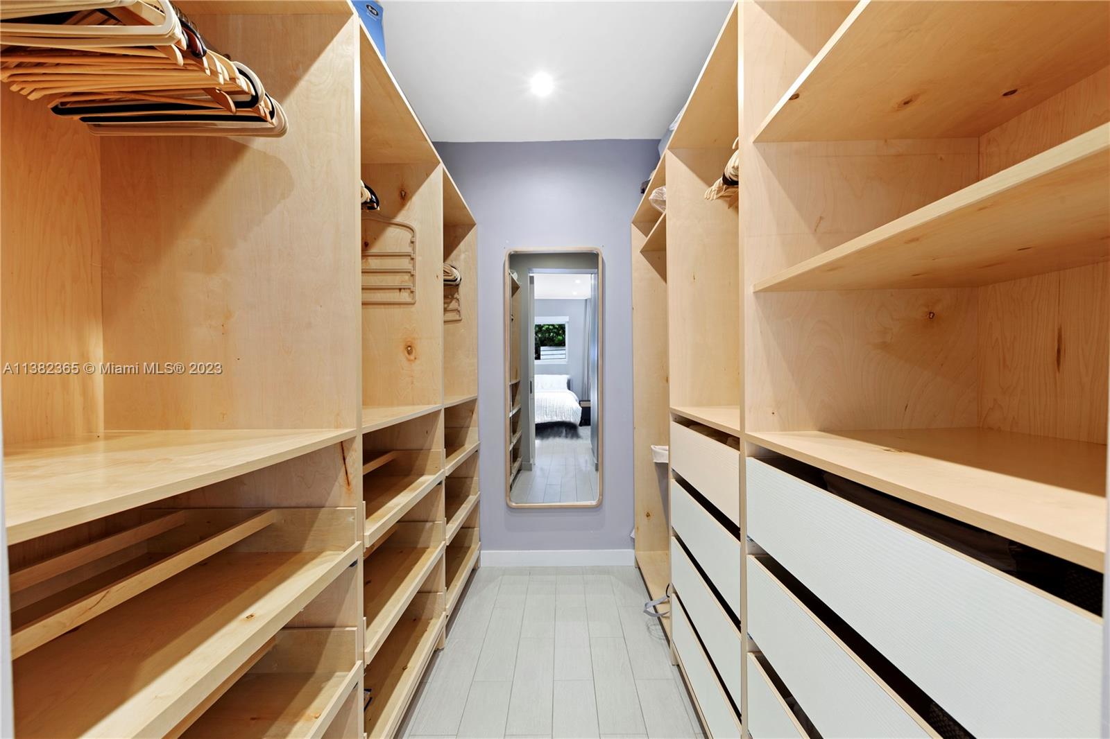 5356 Sunset Drive Miami, FL 33143 - Photo 20 of 29 a view of a hallway with wooden floor and staircase