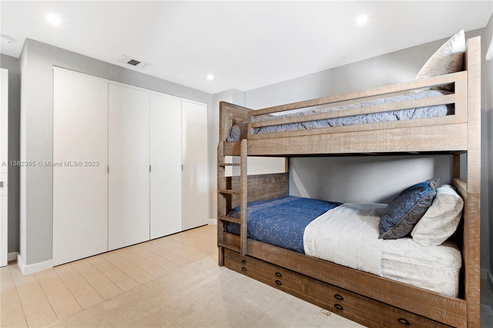 5356 Sunset Drive Miami, FL 33143 - Photo 21 of 29 a bedroom with a bed and a ceiling fan