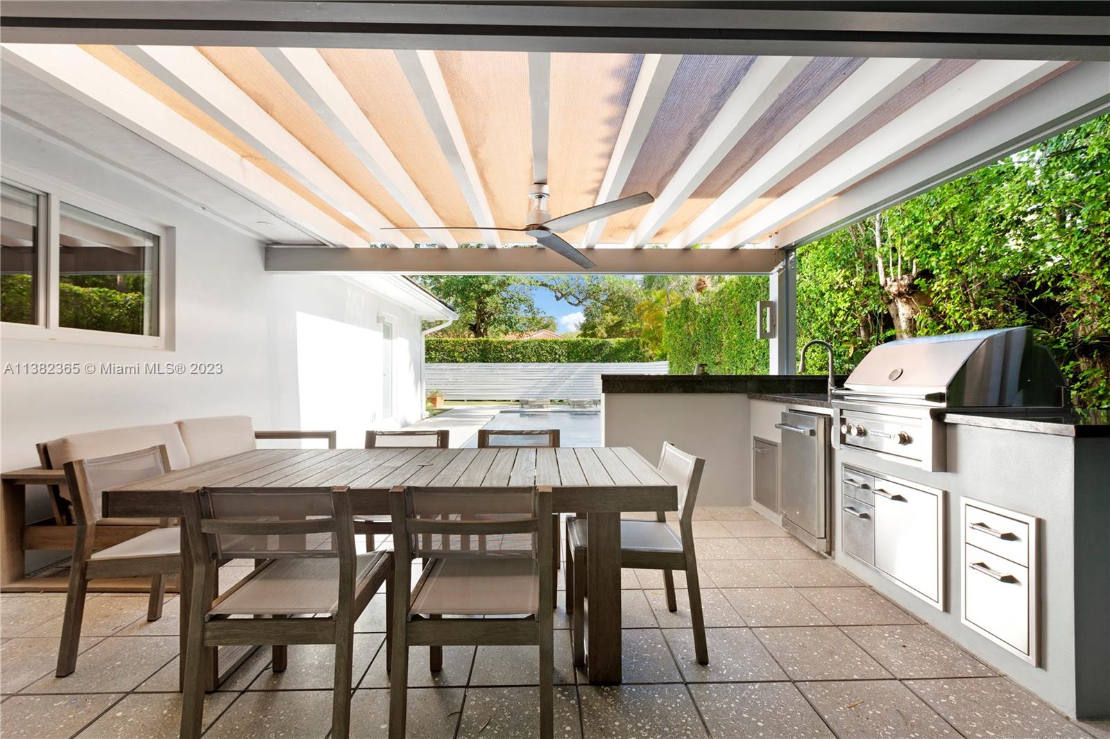 5356 Sunset Drive Miami, FL 33143 - Photo 25 of 29 a view of an outside dining space with furniture window