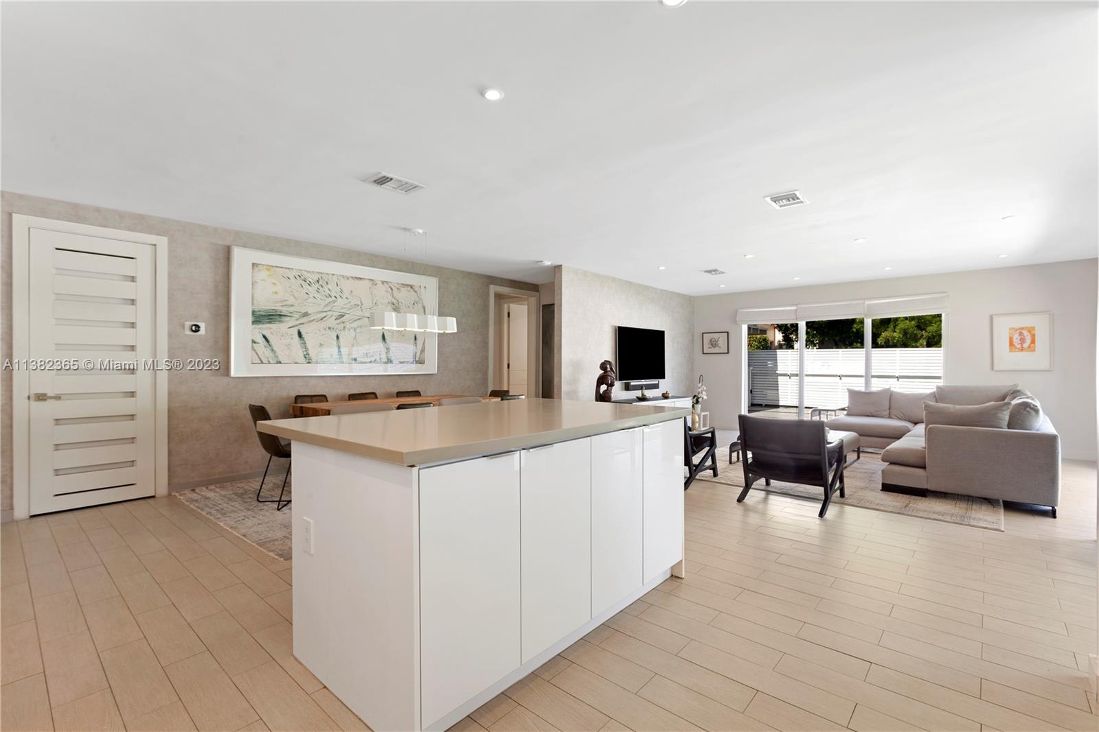 5356 Sunset Drive Miami, FL 33143 - Photo 6 of 29 a large living room with a large window