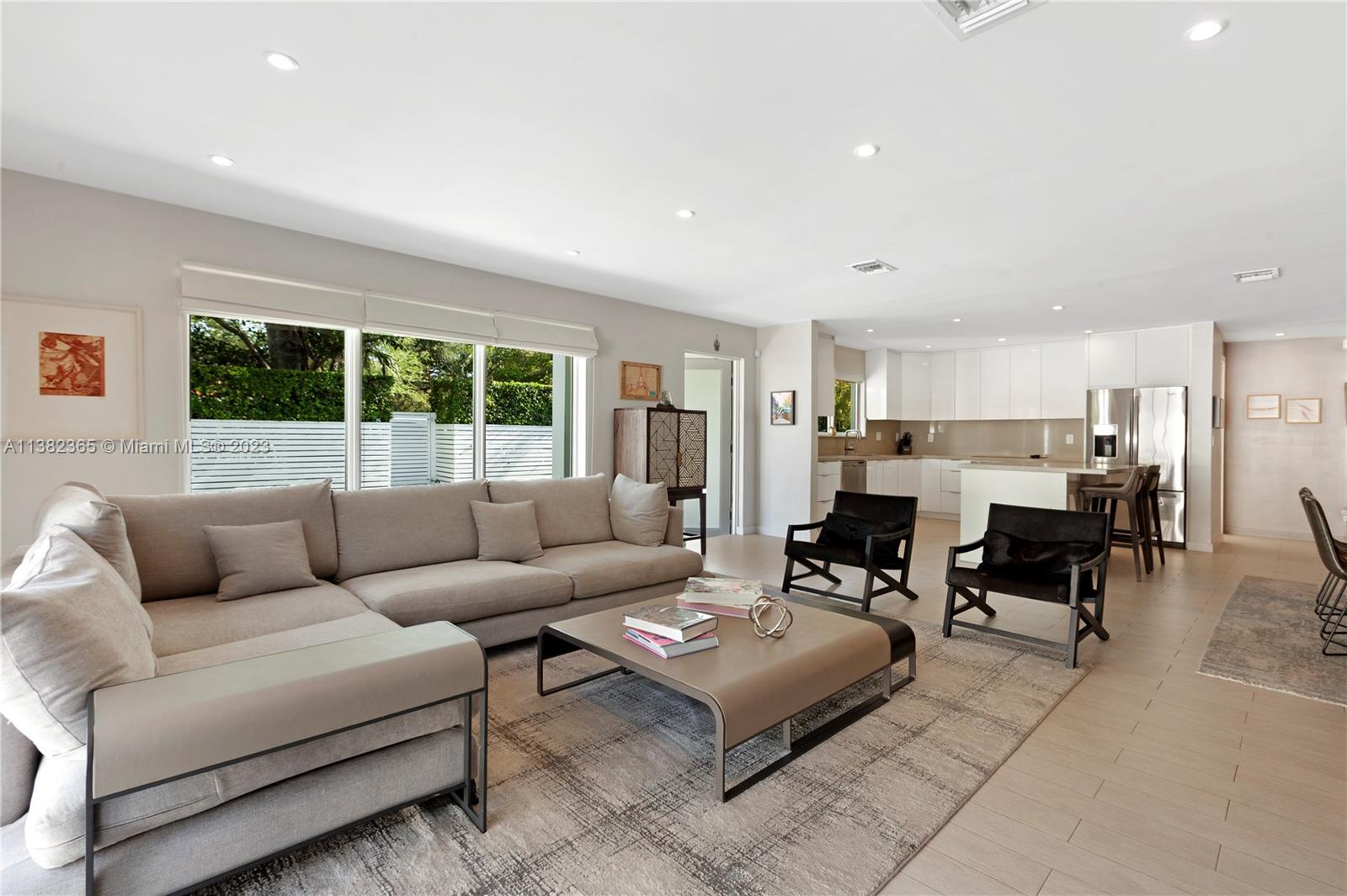 5356 Sunset Drive Miami, FL 33143 - Photo 10 of 29 a living room with furniture and a large window