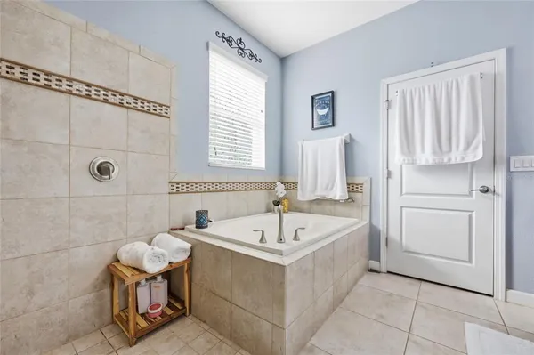 a bathroom with a bathtub and a sink