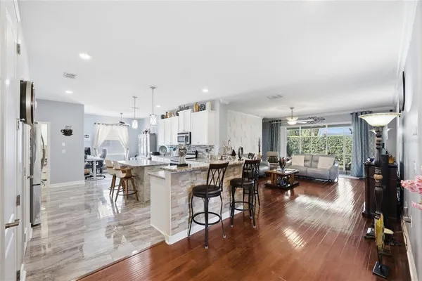 a view of a dining room with furniture window and wooden floor