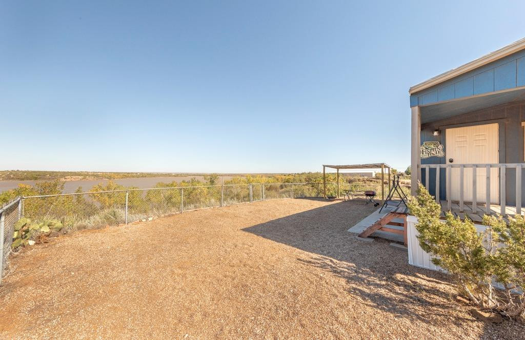 145 Lakesite Drive Spur, TX 79370 - Photo 13 of 20 an ocean beach with an outdoor seating